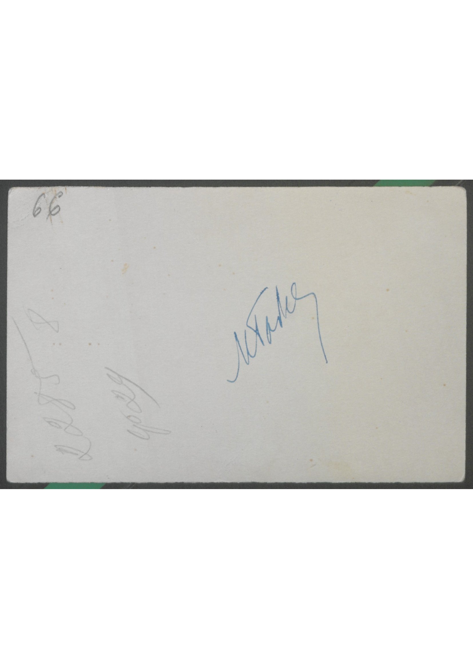 The blank verso of one of the photographs, with a faint blue-ink signature near the top.