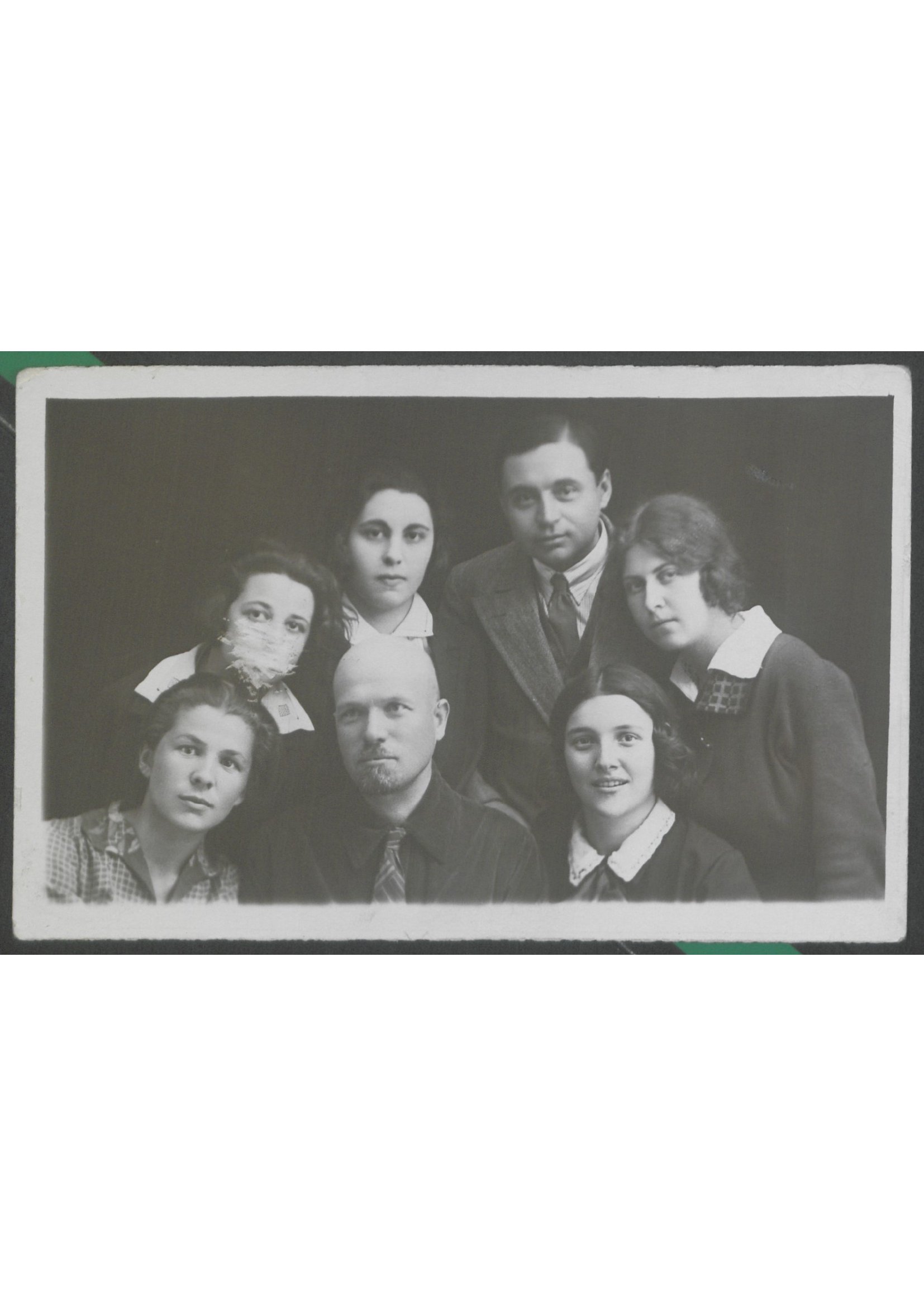 A 1920s/30s studio group portrait of seven people preserved in Mark's Kyiv apartment.